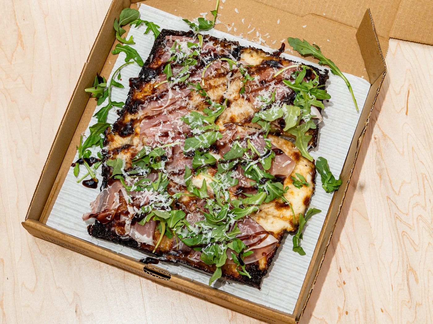Prosciutto and arugula with a balsamic drizzle