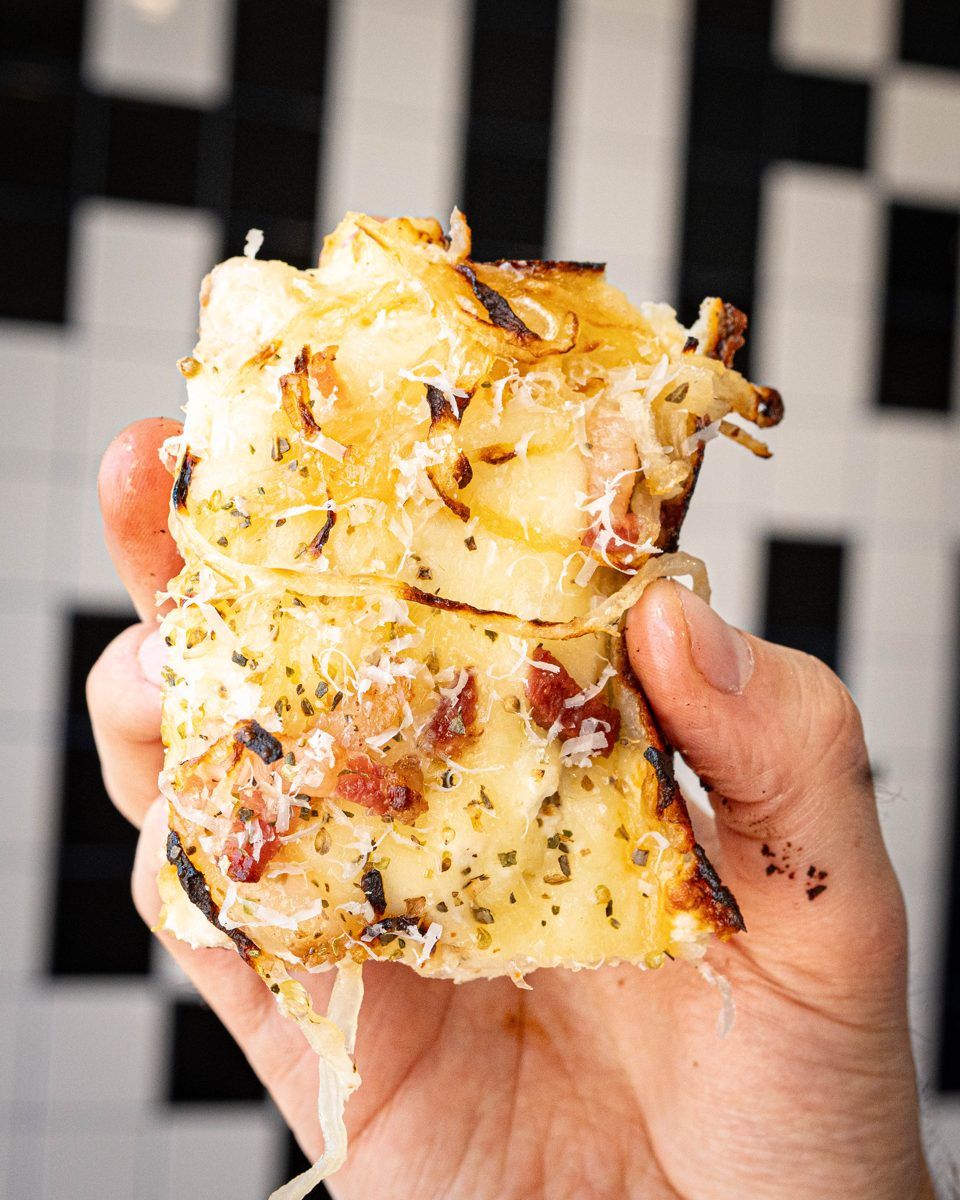 Bacon and caramelized onion, by the slice